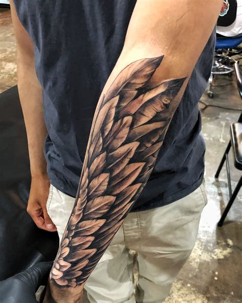 forearm wing tattoo meaning|forearm wing tattoo men.